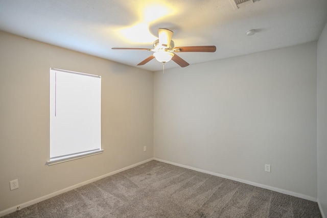 carpeted empty room with ceiling fan