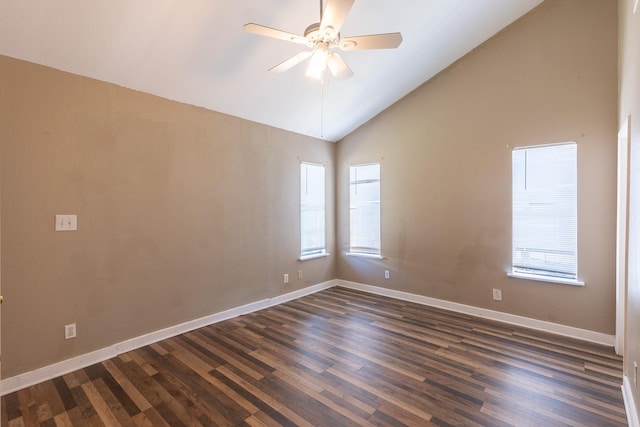 empty room with ceiling fan, lofted ceiling, a wealth of natural light, and dark hardwood / wood-style flooring