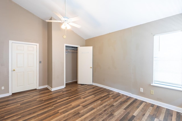 unfurnished bedroom featuring vaulted ceiling, dark hardwood / wood-style floors, ceiling fan, and a closet