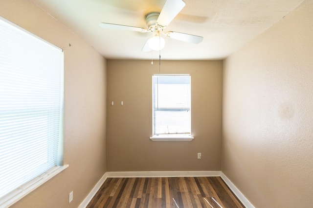 spare room with wood-type flooring and ceiling fan