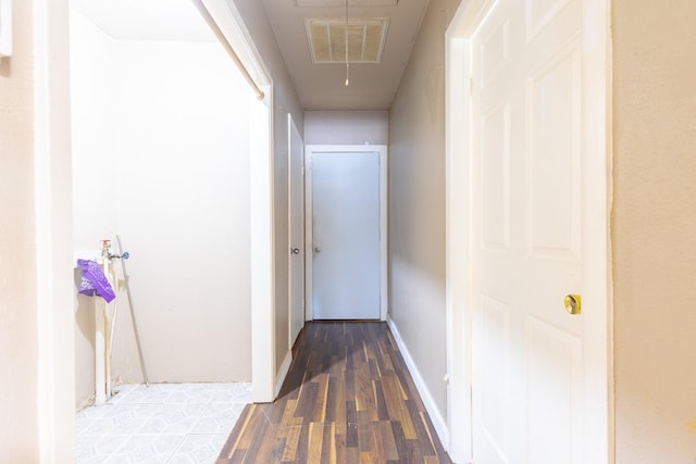 hall with dark hardwood / wood-style flooring