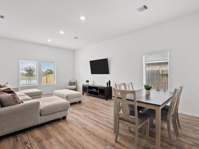 living room with light hardwood / wood-style flooring