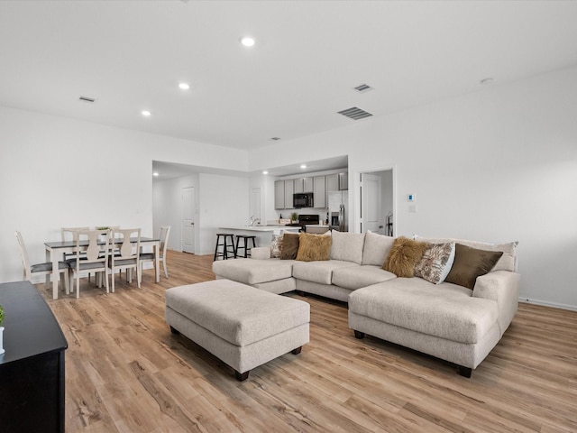512 Maple Bnd, La Marque, TX 77568 - living room with light wood-style flooring and recessed lighting