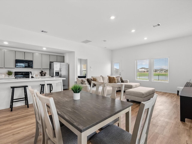 dining area featuring light hardwood / wood-style floors