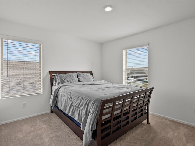 bedroom with light carpet