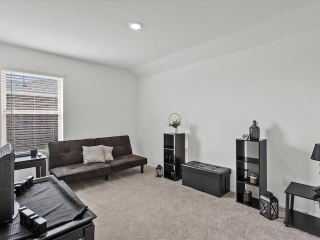 living room with vaulted ceiling and light carpet