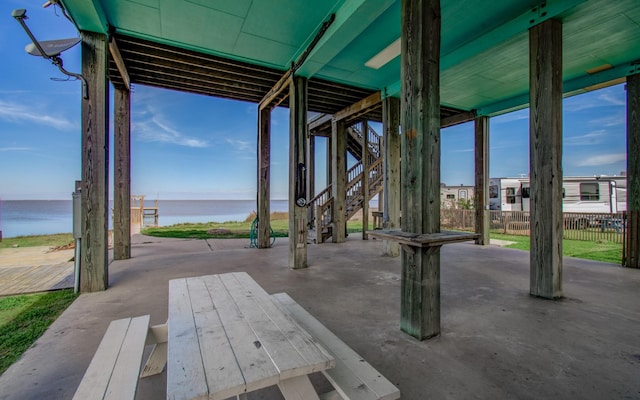 view of patio featuring a water view