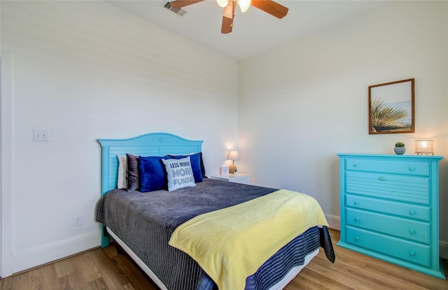 bedroom with ceiling fan and light wood-type flooring