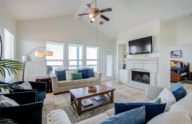 tiled living room with beamed ceiling, ceiling fan, and high vaulted ceiling