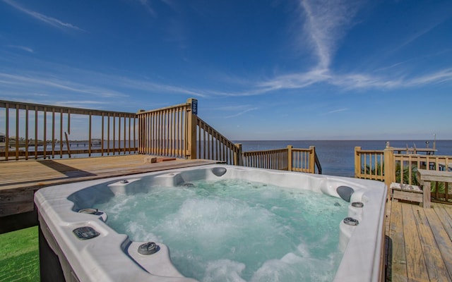 view of swimming pool with a deck with water view