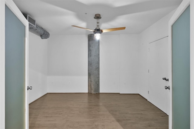 empty room with wood-type flooring and ceiling fan