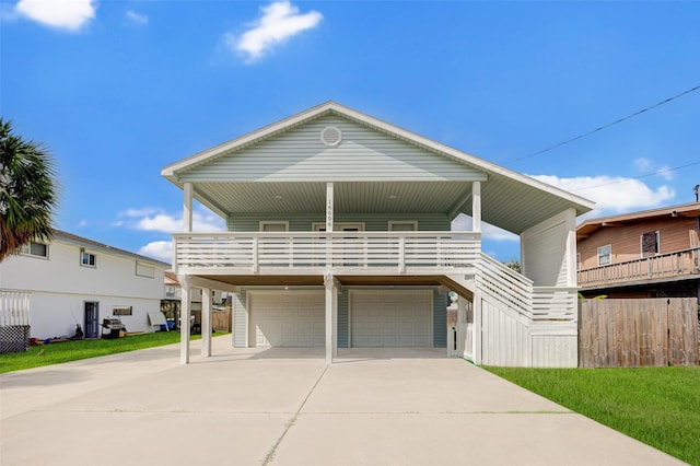 view of front of house featuring a garage and a porch