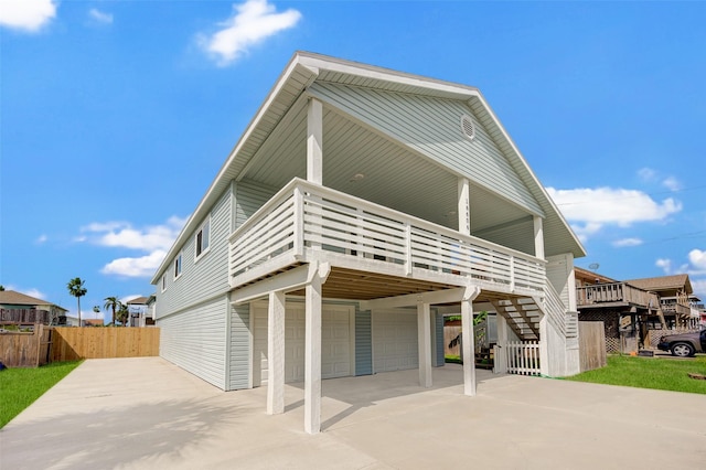 rear view of property featuring a garage