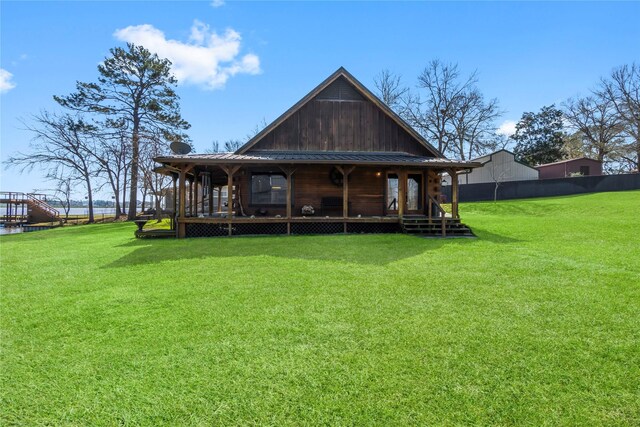 586 Beverly Blvd, Onalaska, TX 77360 - rear view of property with metal roof, board and batten siding, and a water view