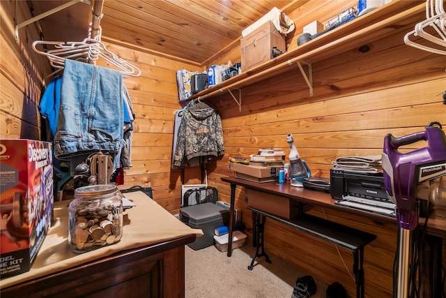 carpeted home office with wooden walls and wood ceiling