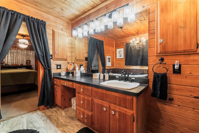 bathroom featuring a notable chandelier, vanity, wood ceiling, and wooden walls