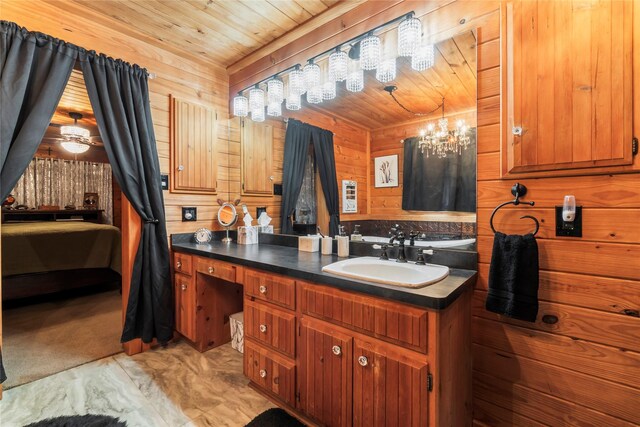 586 Beverly Blvd, Onalaska, TX 77360 - bathroom featuring vanity, wood walls, wood ceiling, marble finish floors, and a chandelier