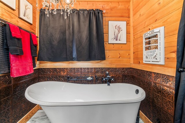 586 Beverly Blvd, Onalaska, TX 77360 - full bathroom featuring a freestanding bath and wood walls