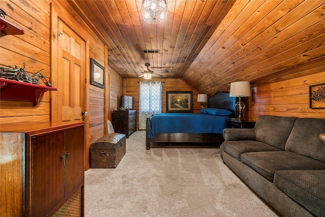 bedroom with vaulted ceiling, wood walls, wood ceiling, and carpet floors