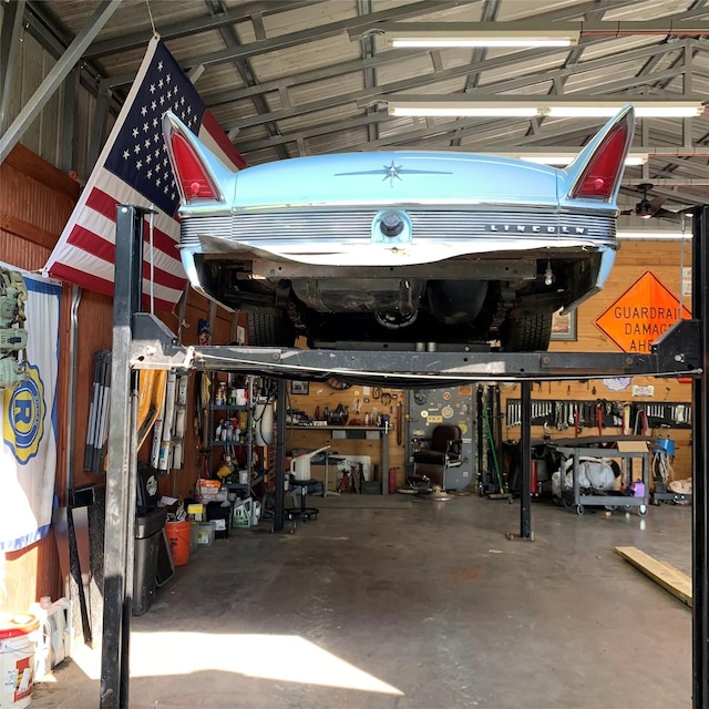 586 Beverly Blvd, Onalaska, TX 77360 - garage featuring a workshop area
