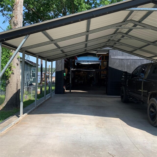586 Beverly Blvd, Onalaska, TX 77360 - view of vehicle parking featuring a carport
