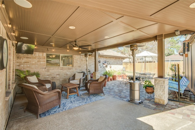 view of patio featuring ceiling fan