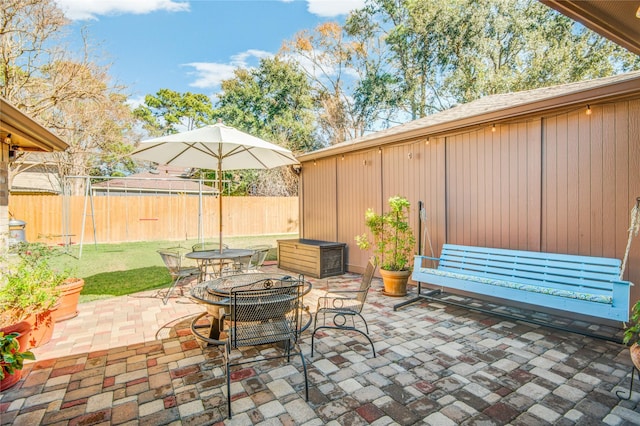 view of patio with a fire pit