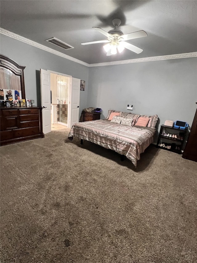 bedroom with ornamental molding, carpet, ceiling fan, and ensuite bath