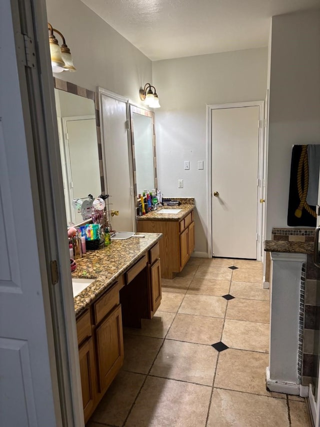 bathroom featuring vanity and tile patterned floors