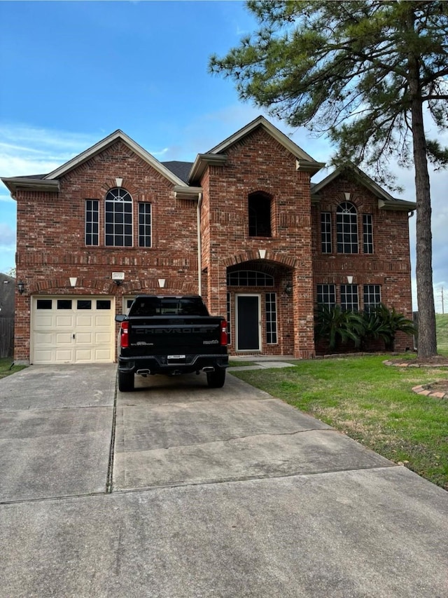 view of front of house featuring a garage and a front lawn