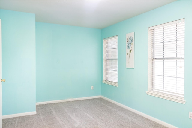 10722 Trail Ridge Dr, Houston, TX 77064 - spare room with baseboards, carpet flooring, and healthy amount of natural light