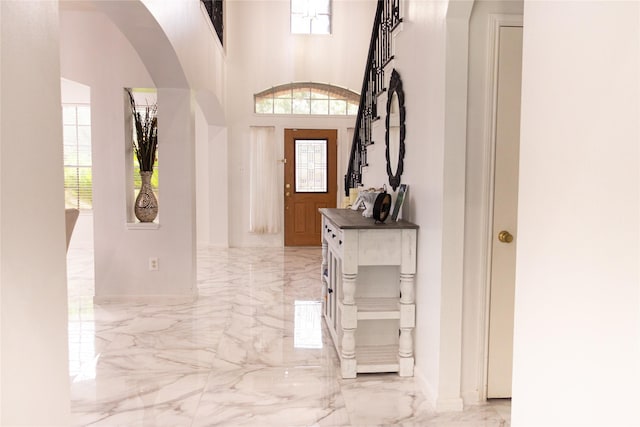 10722 Trail Ridge Dr, Houston, TX 77064 - entryway featuring light marble finish flooring and arched walkways