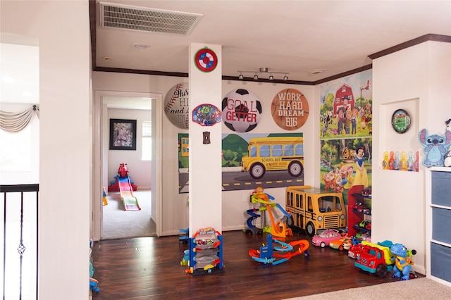10722 Trail Ridge Dr, Houston, TX 77064 - recreation room with wood finished floors, baseboards, and crown molding
