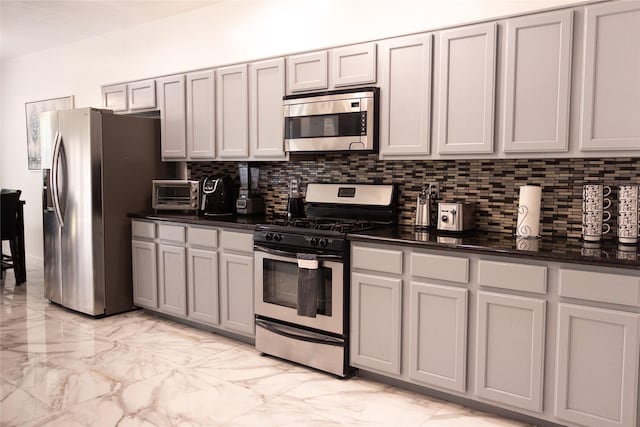 10722 Trail Ridge Dr, Houston, TX 77064 - kitchen with stainless steel appliances, light marble finish floors, backsplash, and gray cabinetry