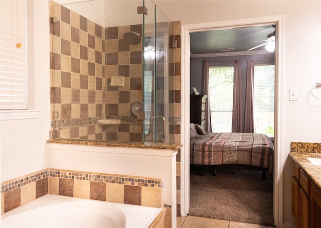 10722 Trail Ridge Dr, Houston, TX 77064 - full bathroom featuring ensuite bath, vanity, a stall shower, a garden tub, and tile patterned floors