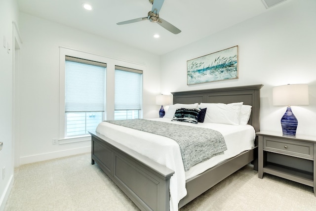 bedroom with light colored carpet and ceiling fan