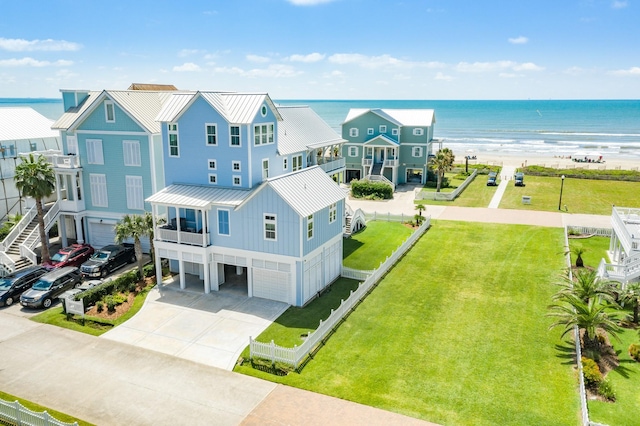 aerial view featuring a water view and a beach view