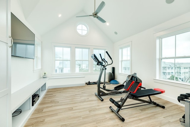 workout room with high vaulted ceiling, light hardwood / wood-style floors, and ceiling fan