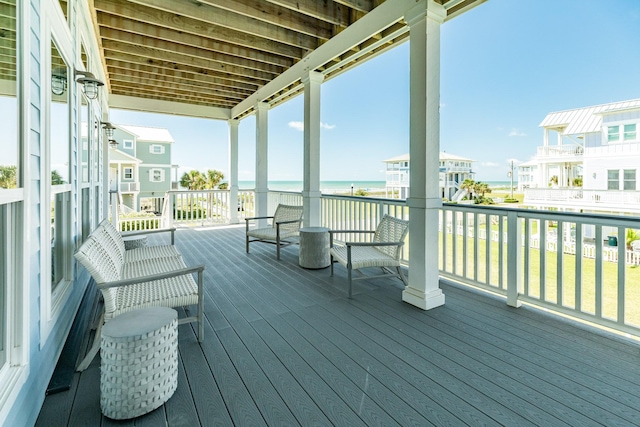 wooden deck featuring a water view