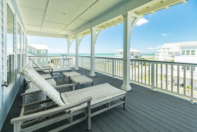 wooden deck featuring a water view