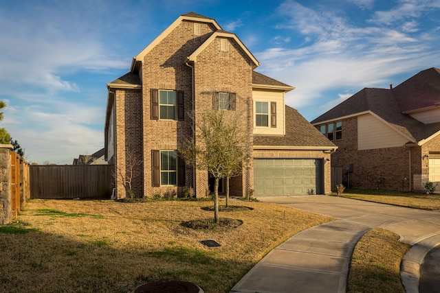 view of front property with a garage and a front yard