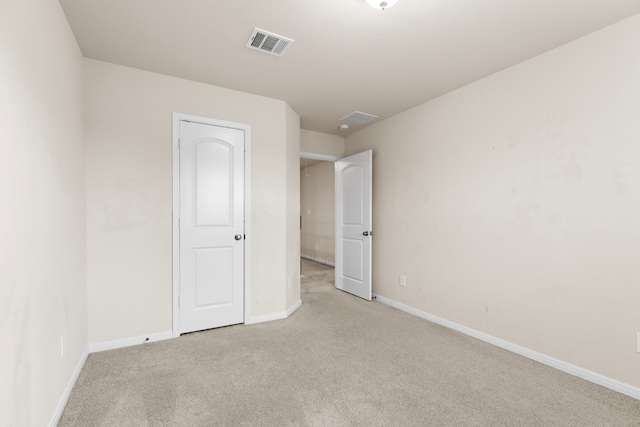 unfurnished bedroom with light colored carpet