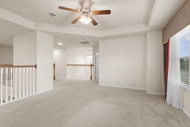 carpeted empty room with ceiling fan