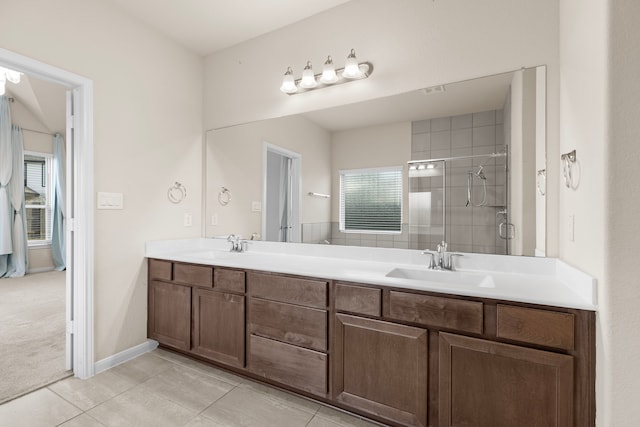 bathroom with tile patterned floors, an enclosed shower, and vanity