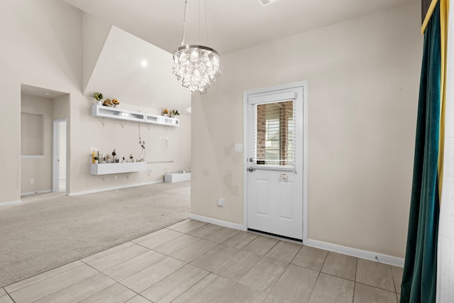 unfurnished dining area featuring a notable chandelier and light colored carpet