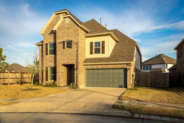 front of property with a garage and a front lawn