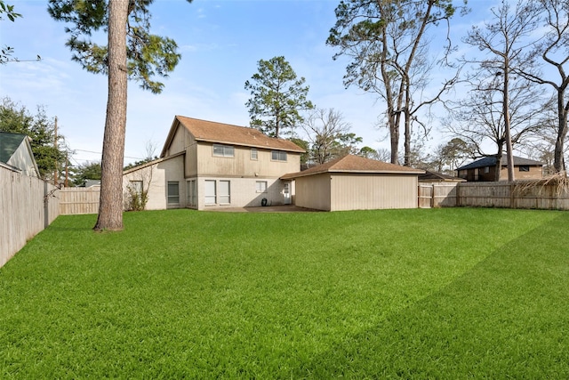 back of property with a lawn