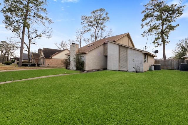 view of property exterior featuring central AC and a lawn