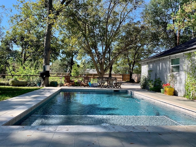 view of swimming pool with a patio area