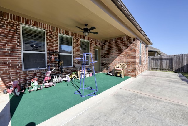 view of patio / terrace featuring a ceiling fan and fence